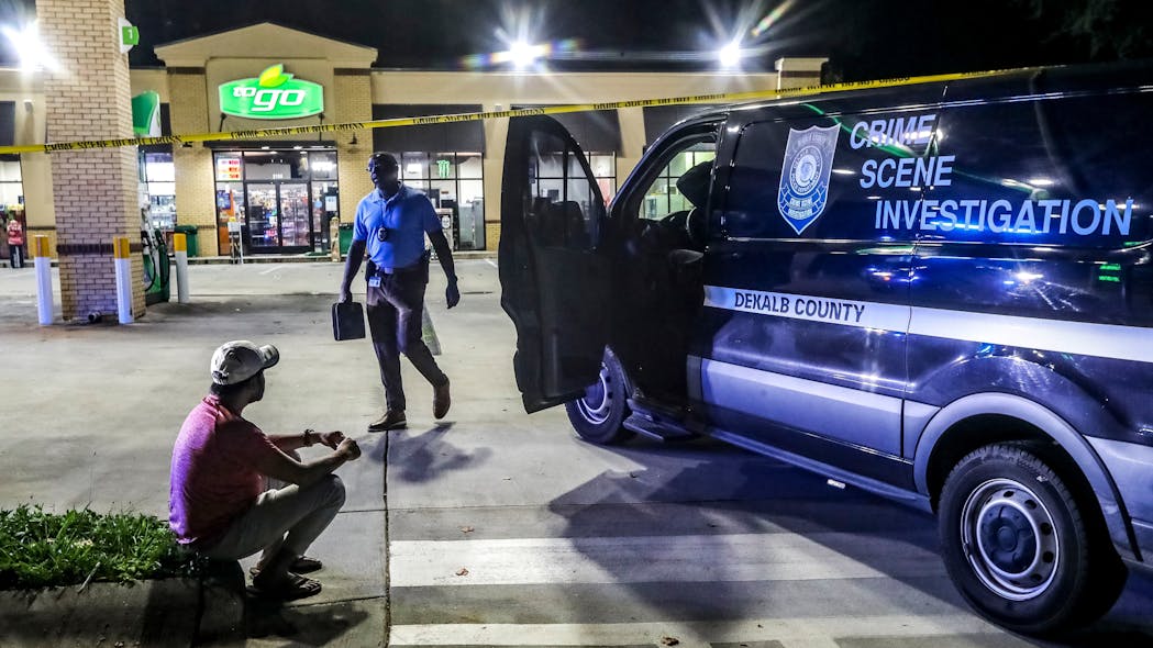 Police investigate after a DeKalb County man was killed during a shooting at gas station just outside of east Atlanta July 19.