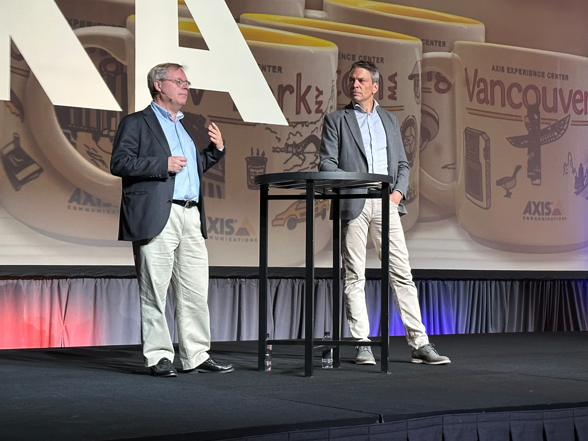 Martin Gren, a co-founder and Deputy Chairman of Axis Communication AB (left), and Fredrick Nilsson, Vice President of the Americas, speak Tuesday at to open the Axis ACCC partner event in Kansas City.