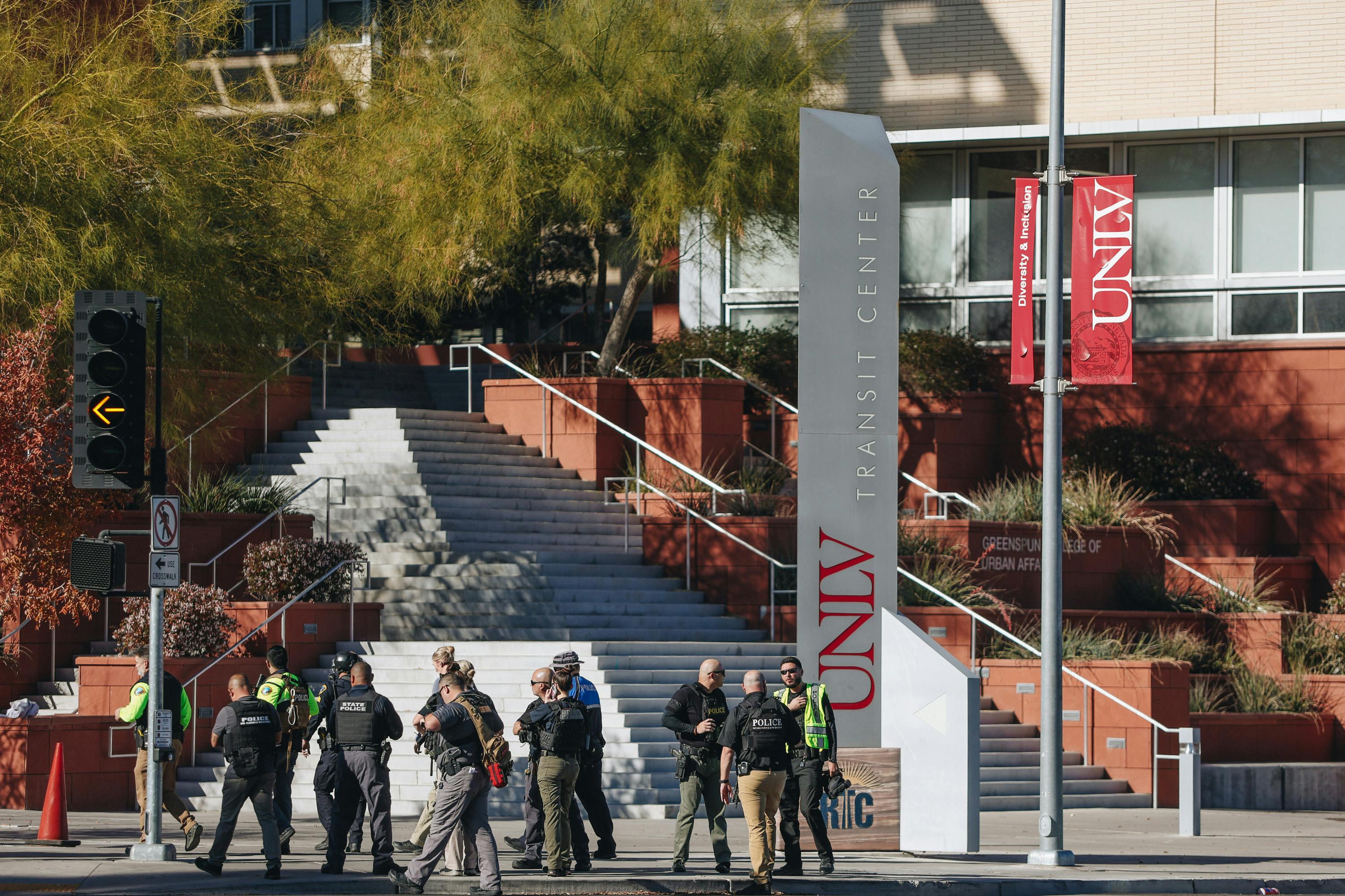 Police are seen at the scene of a shooting on the UNLV campus on Wednesday, Dec. 6, 2023, in Las Vegas.