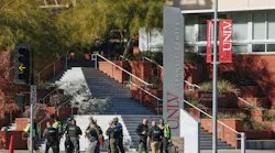 Police are seen at the scene of a shooting on the UNLV campus on Wednesday, Dec. 6, 2023, in Las Vegas.