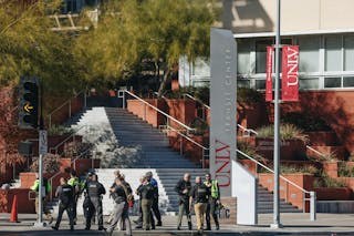 Police are seen at the scene of a shooting on the UNLV campus on Wednesday, Dec. 6, 2023, in Las Vegas.