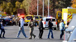 Amanda Perez is comforted by fellow student Alejandro Barron near Maryland Parkway following a shooting on the UNLV campus in Las Vegas Wednesday, Dec. 6, 2023.