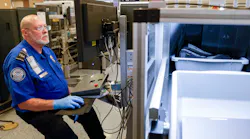 TSA transportation security officer James Pickett checks luggage with an x-ray machine at a security checkpoint inside Terminal D, Tuesday, Aug. 8, 2023 at DFW International Airport.