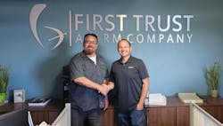 Joe Bowman, Owner of First Trust, and Eric Garner, President of Pye-Barker's alarm division. Joe Bowman, Owner of First Trust, and Eric Garner, President of Pye-Barker's alarm division.