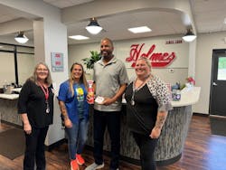 Holmes Security Systems donated fire spray and first aid kits to its community. Holmes Security Systems donated fire spray and first aid kits to its community.