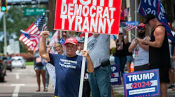Tom Sartori, 72, of Holiday, holds a sign in support of former President Donald Trump along Court Street in downtown Clearwater on Sunday, a day after the presumptive GOP presidential nominee was injured during an assassination attempt at a rally in Pennsylvania.