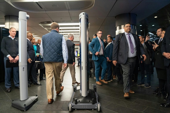 Members of law enforcement demonstrate an Evolv weapons detection during a press conference announcing weapons detectors for the New York City subway system in the Fulton Transit Center March 28, 2024, in New York City.