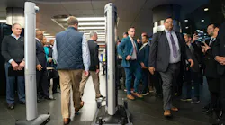 Members of law enforcement demonstrate an Evolv weapons detection during a press conference announcing weapons detectors for the New York City subway system in the Fulton Transit Center March 28, 2024, in New York City.