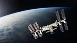 ISS over the planet Earth. Elements of this image furnished by NASA.