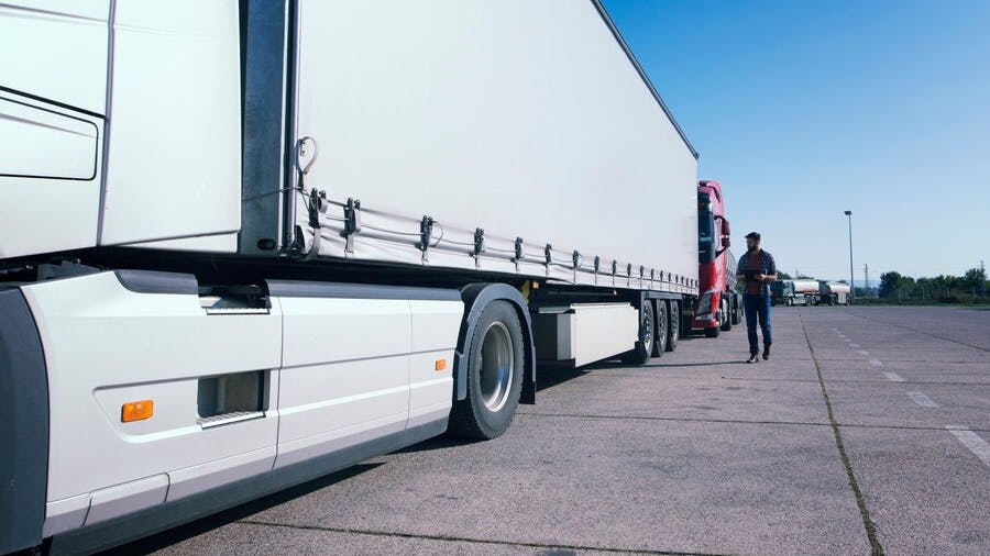 66c8d5150297442384ffec36 Truckdriverinspectingtrucklongvehiclebeforedriving