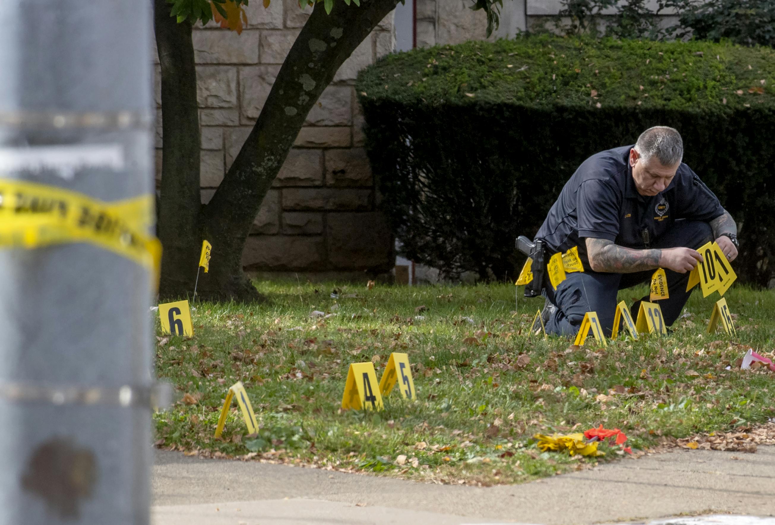 Police officials investigate outside Destiny of Faith Church in the 3700 block of Brighton Road where Six people were shot near a church while a funeral was taking place in Brighton Heights on Oct. 28, 2022, police said. The shooting occurred during the funeral for John Hornezes, Jr.