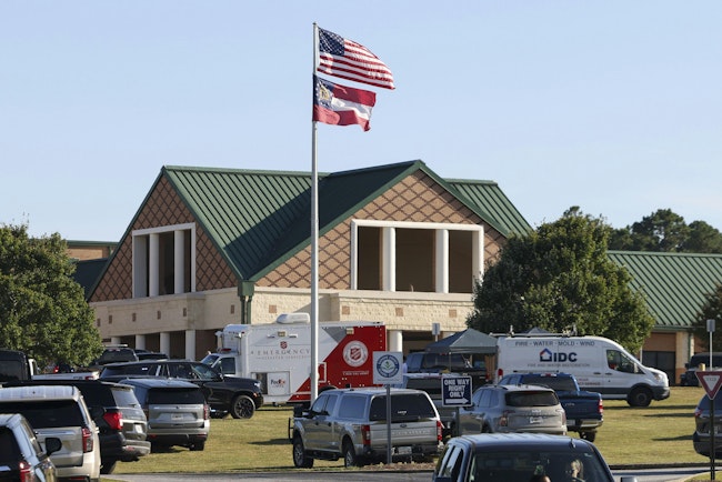 The front of Apalachee High School is filled with emergency and law enforcement automobiles, Wednesday, Sept. 4, 2024, in Winder, Ga. One person is in custody after a shooting at Apalachee High School in Barrow County injured multiple people Wednesday morning.