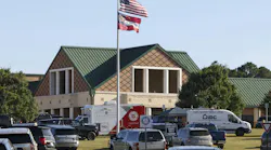 The front of Apalachee High School is filled with emergency and law enforcement automobiles, Wednesday, Sept. 4, 2024, in Winder, Ga. One person is in custody after a shooting at Apalachee High School in Barrow County injured multiple people Wednesday morning.