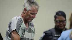 Colin Gray, 54, the father of Apalachee High School shooting suspect Colt Gray, 14, enters the Barrow County courthouse for his first appearance, on Sept. 6, 2024, in Winder, Georgia. Colin Gray is being charged with involuntary manslaughter, second-degree murder and cruelty to children after his son opened fire and killed 4 at the high school on Wednesday.