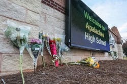 Flowers are placed at the foot of the welcome sign to Apalachee High School for a makeshift memorial on Sept. 5, 2024. Flowers are placed at the foot of the welcome sign to Apalachee High School for a makeshift memorial on Sept. 5, 2024.
