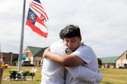 Jose Ortiz, 14 year-old student and friend of one of the victims, is consoled at Apalachee High School on Sept. 5, 2024, in Winder, Georgia. Two students and two teachers were shot and killed at the school on September 4, 2024. Jose Ortiz, 14 year-old student and friend of one of the victims, is consoled at Apalachee High School on Sept. 5, 2024, in Winder, Georgia. Two students and two teachers were shot and killed at the school on September 4, 2024.