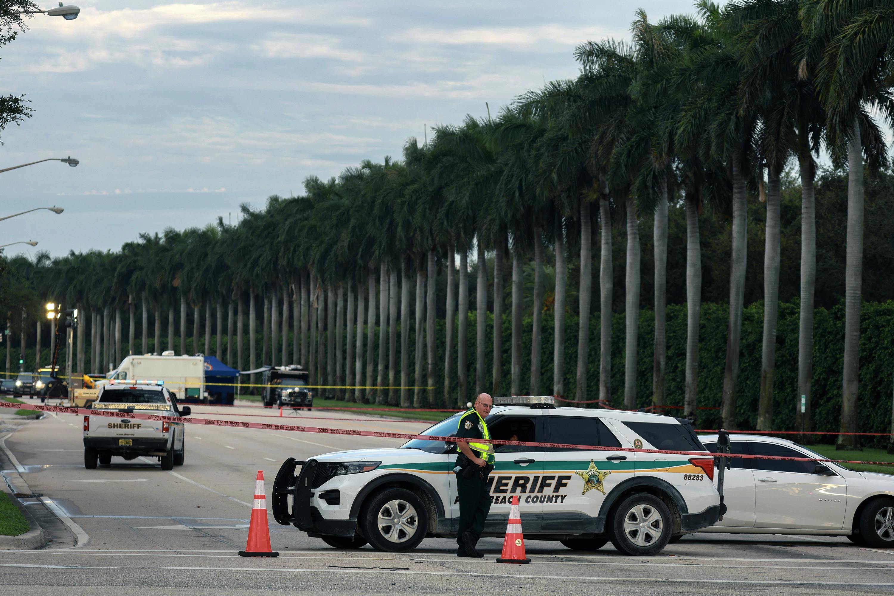 Palm Beach County Sheriff personnel block a road near the Trump International Golf Club after an apparent assassination attempt of former President Donald Trump on Sept. 16, 2024, in West Palm Beach, Florida. The FBI and U.S. Secret Service, along with the Palm Beach County Sheriff's office, are investigating the incident, which the FBI said 'appears to be an attempted assassination of former President Trump' while he was golfing at Trump International Golf Club.