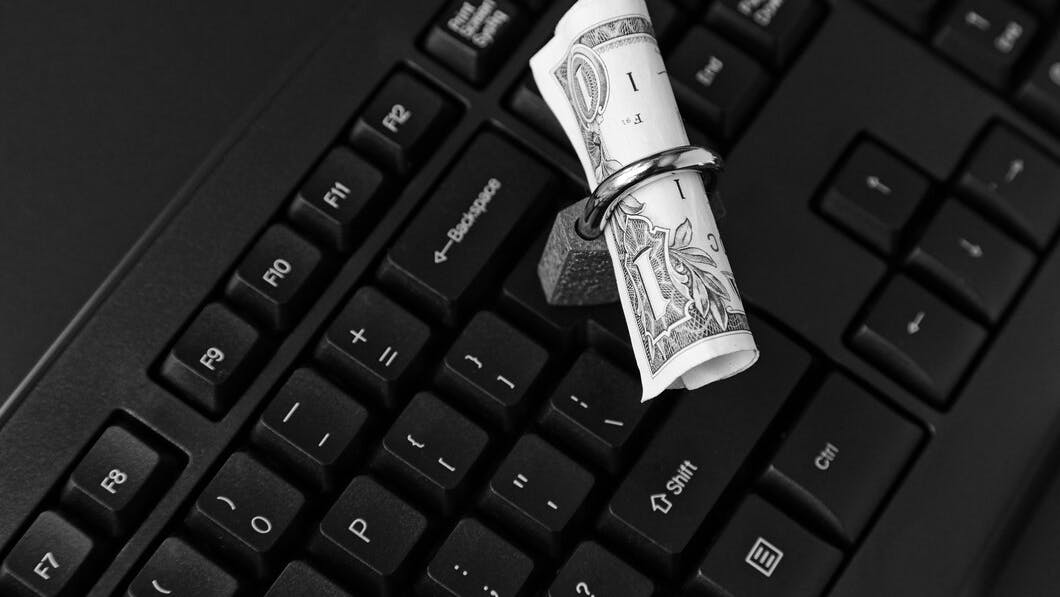 671baa3a165d9d74806a570a Highangleshotlockarounddollarbillblacklaptop 18162