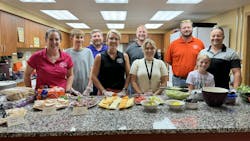 The Custom Alarm team and family cooked and served meals to families at Ronald McDonald House. The Custom Alarm team and family cooked and served meals to families at Ronald McDonald House.