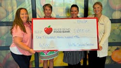 Per Mar employees present the River Bend Food Bank with a donation. Per Mar employees present the River Bend Food Bank with a donation.