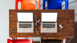 676067bfe8feecdeaa1cffa4 Twoopenlaptopswithpencilsholderwoodentablewithempt 676067bfe8feecdeaa1cffa4 Twoopenlaptopswithpencilsholderwoodentablewithempt