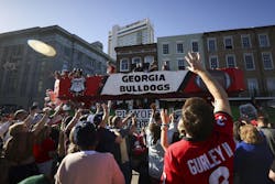 Georgia cheerleaders throw beads to fans as the Georgia float travels down Decatur Street during the Allstate Sugar Bowl New Year’s Eve Parade, Tuesday, Dec. 31, 2024, in New Orleans. Georgia cheerleaders throw beads to fans as the Georgia float travels down Decatur Street during the Allstate Sugar Bowl New Year’s Eve Parade, Tuesday, Dec. 31, 2024, in New Orleans.