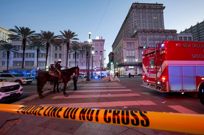 Police cordon off the intersection of Canal Street and Bourbon Street in the French Quarter of New Orleans on Wednesday, Jan. 1, 2025. At least 15 people were killed and 30 injured Wednesday when a vehicle plowed overnight into a New Year's crowd in the heart of the thriving New Orleans tourist district, authorities said.