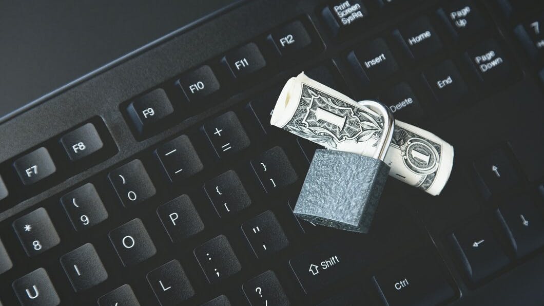 67b6279ef079cdc2b657db1c Highangleshotlockarounddollarbillblacklaptop 18162