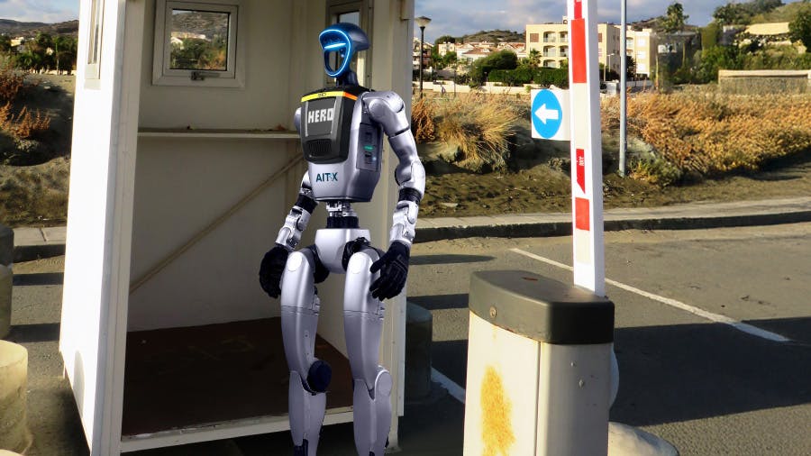 Artist's depiction of a HERO humanoid robot standing post at a secure gate.
