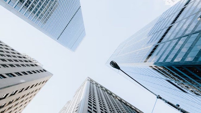 6815185c1b5d466f9932c65c Verticallowangleshotskyscrapersbrightskynewyorkcit