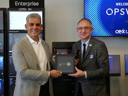 Key Hand Off: Benny Czarny, founder & CEO, OPSWAT(L); Takis Karantonis, Chair, Arlington County Board (R) Key Hand Off: Benny Czarny, founder & CEO, OPSWAT(L); Takis Karantonis, Chair, Arlington County Board (R)