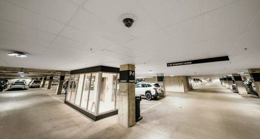 A surveillance camera monitors vehicle activity in a Mall of America parking garage, part of an expanded AI-powered analytics system enhancing safety and operational efficiency.