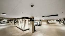 A surveillance camera monitors vehicle activity in a Mall of America parking garage, part of an expanded AI-powered analytics system enhancing safety and operational efficiency.