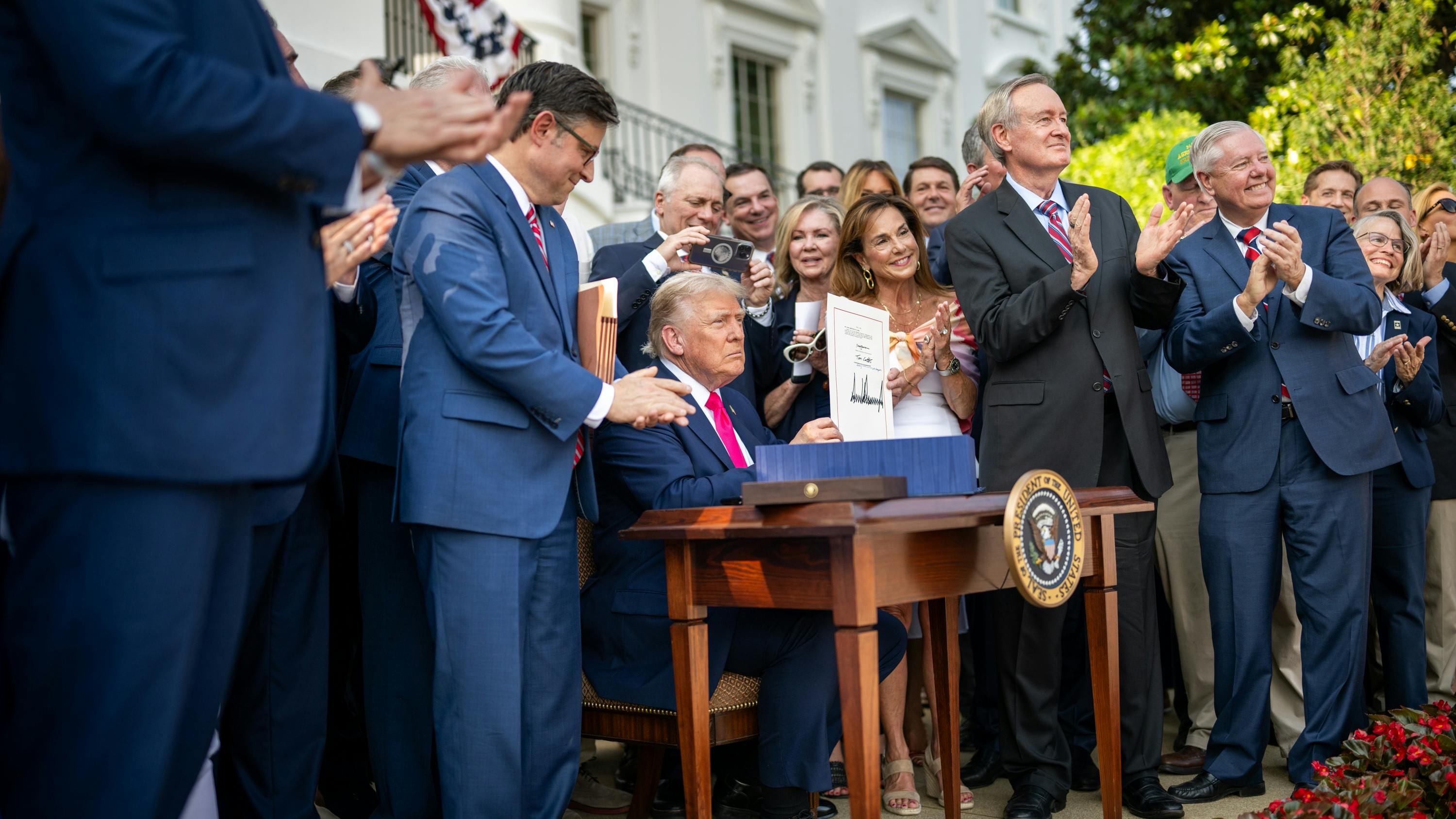 President Donald Trump signed the One Big Beautiful Bill Act (OBBBA) on the South Lawn of the White House during a 4th of July picnic.