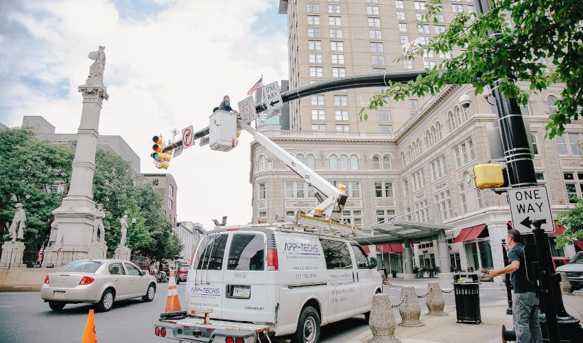 Technicians work on Lancaster&rsquo;s downtown traffic camera system from a App-Techs Corp. bucket truck, part of the city&rsquo;s expanded camera network that is helping police enhance public safety and investigations.