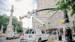 Technicians work on Lancaster’s downtown traffic camera system from a App-Techs Corp. bucket truck, part of the city’s expanded camera network that is helping police enhance public safety and investigations.