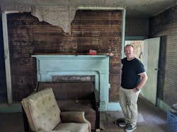 James Ward stands inside a 130-year-old home that is about to undergo a full remodel. His company will be wiring the property and installing modern technology as part of the renovation. James Ward stands inside a 130-year-old home that is about to undergo a full remodel. His company will be wiring the property and installing modern technology as part of the renovation.