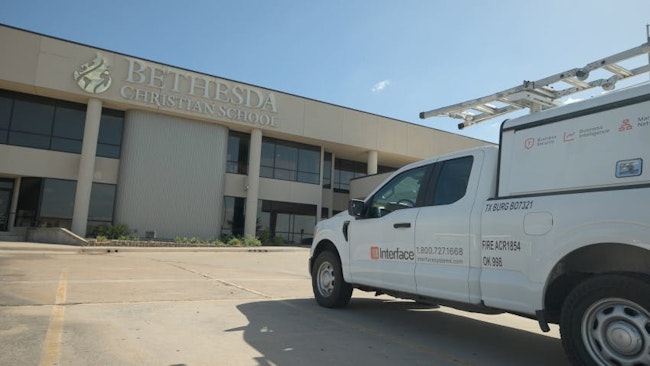 An Interface Systems service vehicle is pictured outside Bethesda Christian School in Fort Worth, Texas, where the company modernized security and communication systems for the church and school campus.