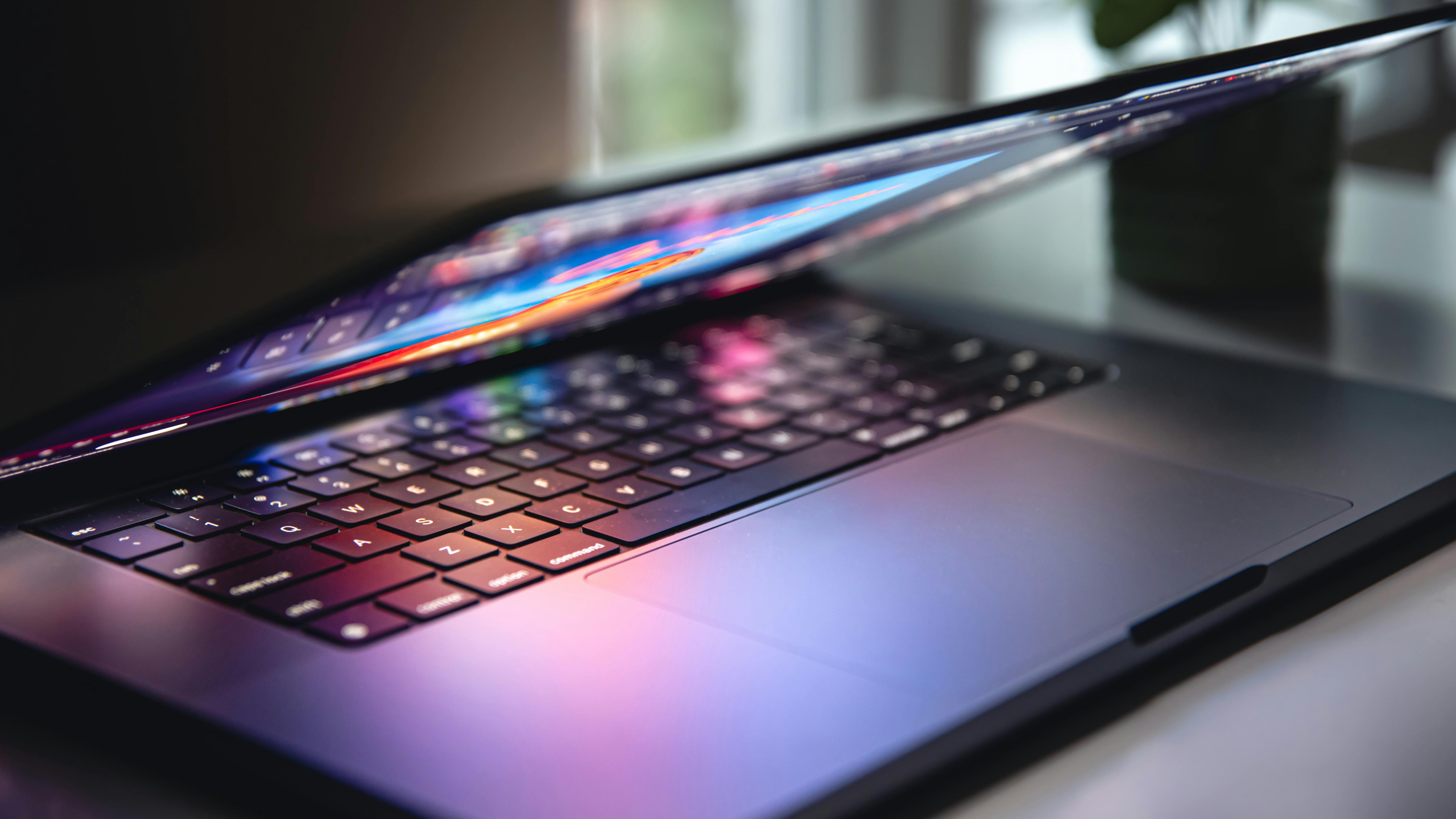 68c04afde4db0af44de2a79b Closeuplaptopkeyboardcolorfulneonilluminationbackl