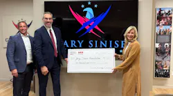 Securitas Technology team members present a donation check to the Gary Sinise Foundation, reflecting attendee engagement generated at the company’s GSX 2025 booth.
