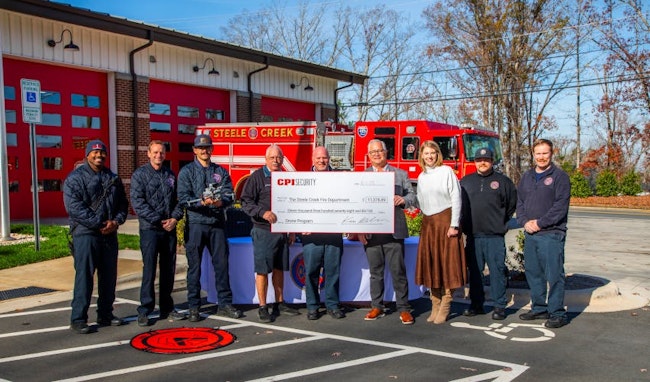 Members of the Steele Creek Fire Department and CPI Security gather outside the station as the company presents a check funding the department’s first drone, supporting enhanced search and rescue capabilities.