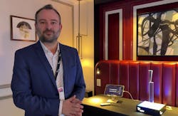 Jeroen Hoet, CEO of Eyeo Imaging, demonstrated how the sensor works on a significantly enlarged version of what it is on the chip. The light enters the top of the sensor unit on the table, a photon hits in the middle, it is collected into a funnel, and is then brought down into a waveguide, where the technology essentially splits the light into different colors. At the output, the different colors are injected into the pixels. Jeroen Hoet, CEO of Eyeo Imaging, demonstrated how the sensor works on a significantly enlarged version of what it is on the chip. The light enters the top of the sensor unit on the table, a photon hits in the middle, it is collected into a funnel, and is then brought down into a waveguide, where the technology essentially splits the light into different colors. At the output, the different colors are injected into the pixels.