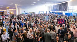 Crowds of ISC West 2026 attendees gather outside the exhibition hall on opening day in Las Vegas, lining up for access to the show floor.