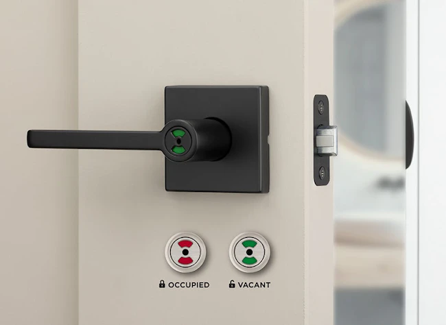 Kwikset&rsquo;s Halifax Occupancy Indicator Lever features a red and green visual display to indicate bathroom availability from a distance.