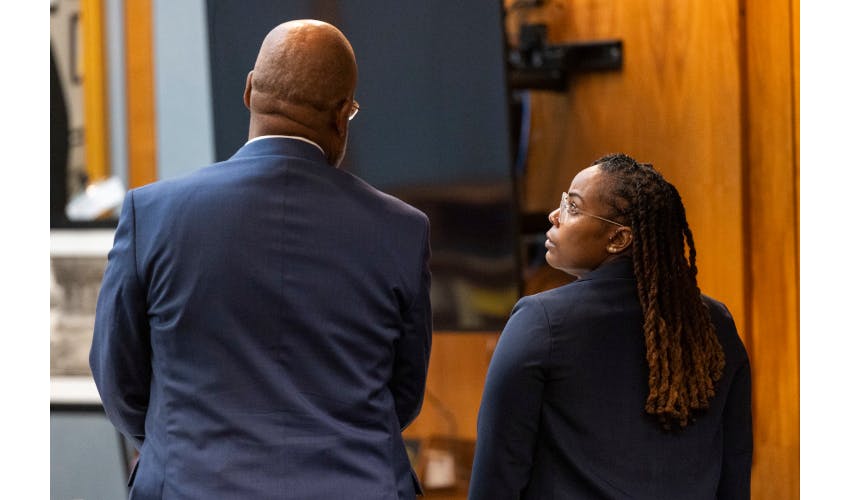 Ebony Parker, right, speaks with her attorney, Curtis M. Rogers, during pretrial motions for her trial on felony child neglect charges at the Newport News Circuit Court in Newport News, May 18, 2026.