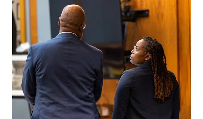 Ebony Parker, right, speaks with her attorney, Curtis M. Rogers, during pretrial motions for her trial on felony child neglect charges at the Newport News Circuit Court in Newport News, May 18, 2026.