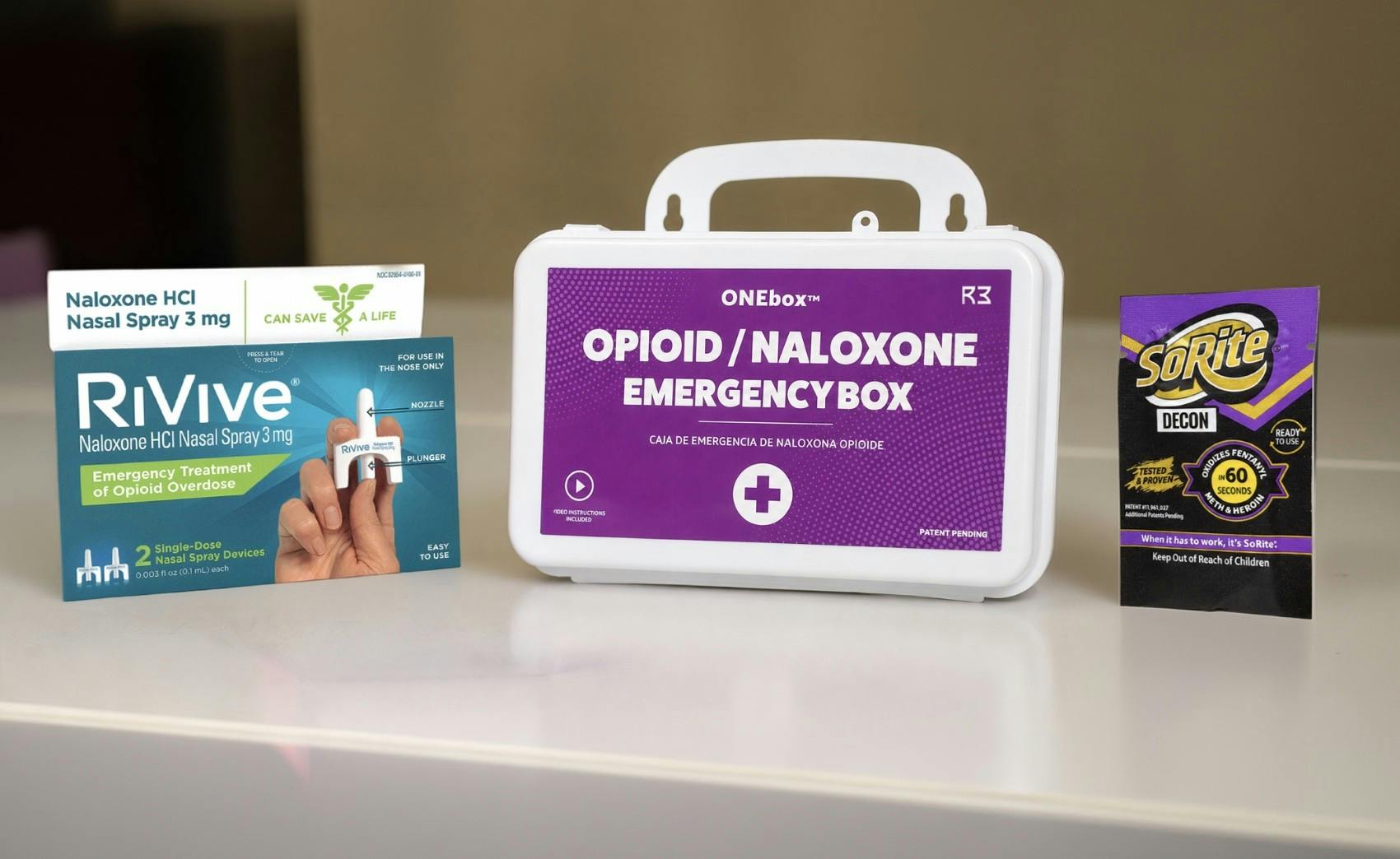 ONEbox emergency response station featuring integrated overdose response tools alongside SoRite DECON towelettes and canister for rapid narcotic decontamination in public safety settings.