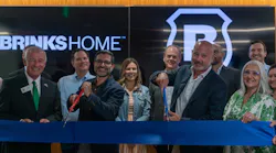 Brinks Home executives, employees and local officials participate in a ribbon-cutting ceremony celebrating the opening of the company's new headquarters in Farmers Branch, Texas, on June 9.