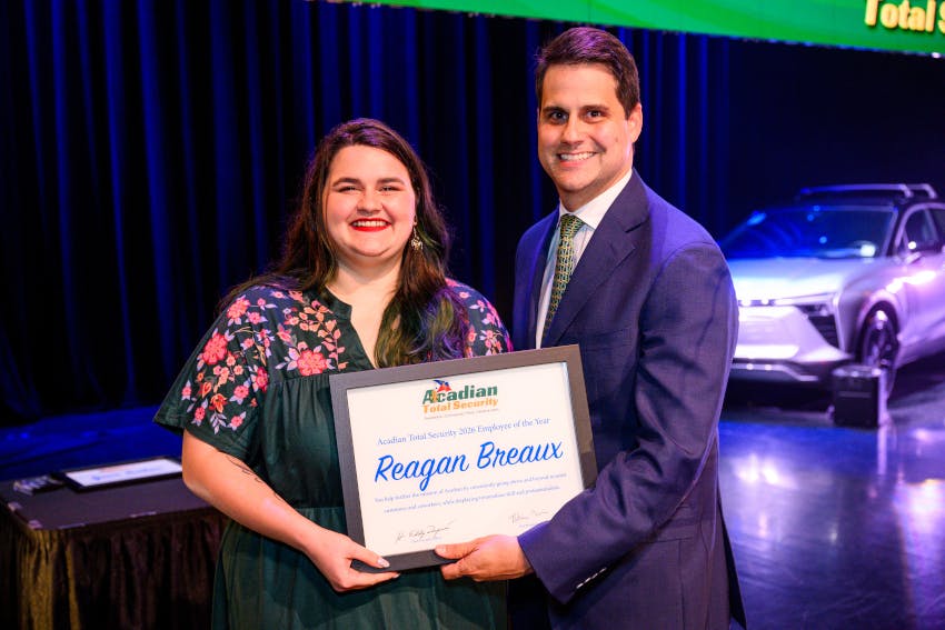 Regan Breaux, Sales Support Coordinator at Acadian Total Security, receives the company's 2025 Employee of the Year award in recognition of her commitment to customer service, teamwork and operational excellence.