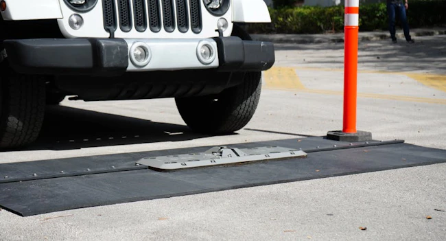Vehicle screening checkpoints are increasingly being integrated with license plate recognition, access control and centralized monitoring systems to improve visibility at stadium entry points.